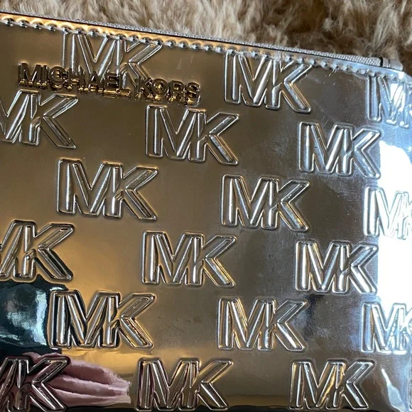Michael Kors Metallic Silver MK Embossed Wristlet - Picture 2 of 6
